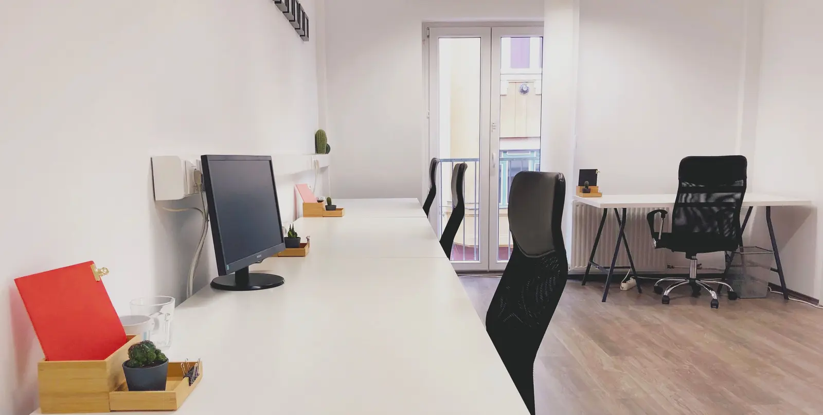 The best coworking spaces in Budapest Bright and modern coworking office space in Budapest, showcasing minimalist design and contemporary furniture.