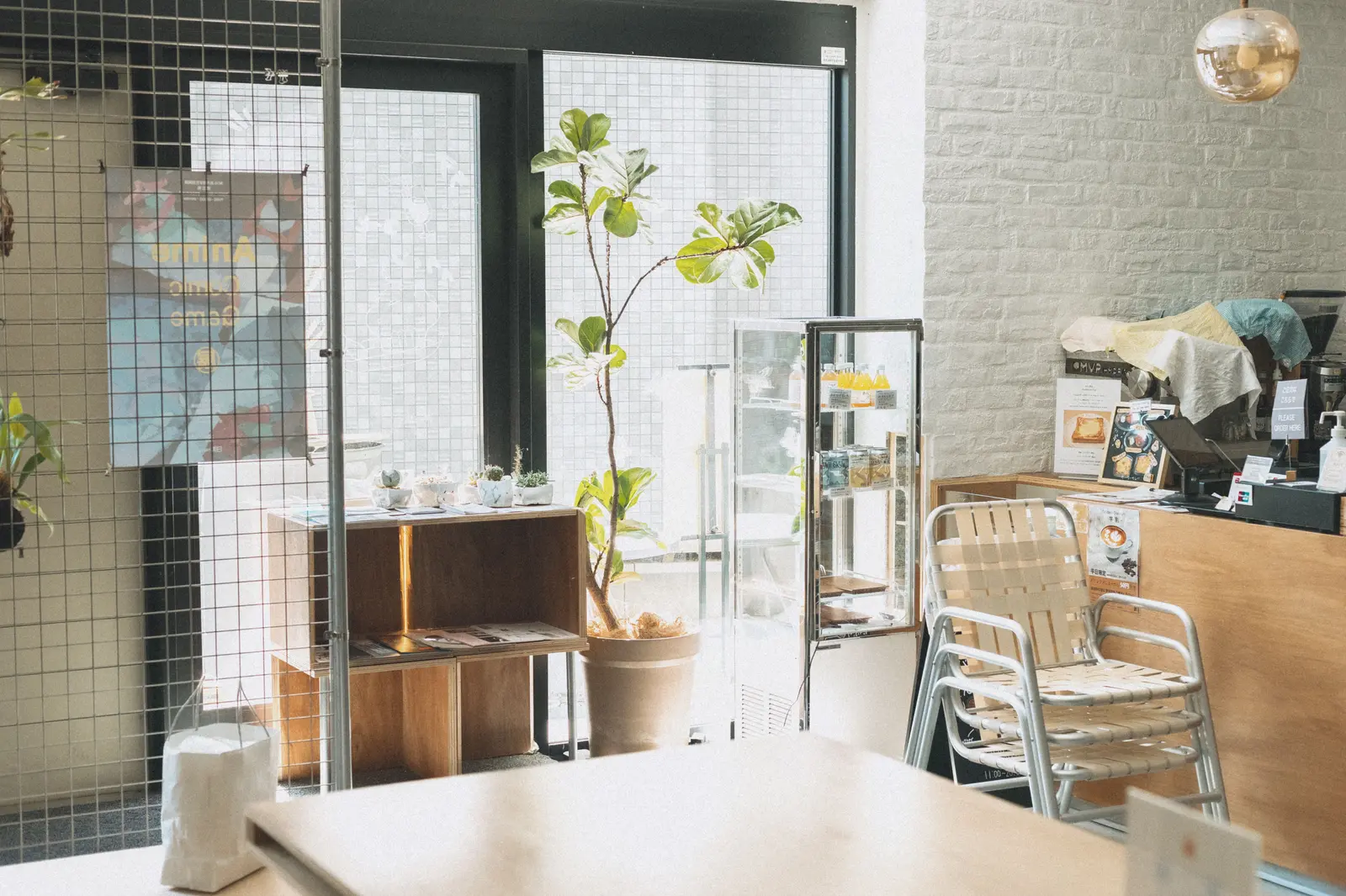 The best cafés to work from in Tokyo Bright and cozy coffee shop in Shinjuku, Tokyo featuring modern decor and natural light.