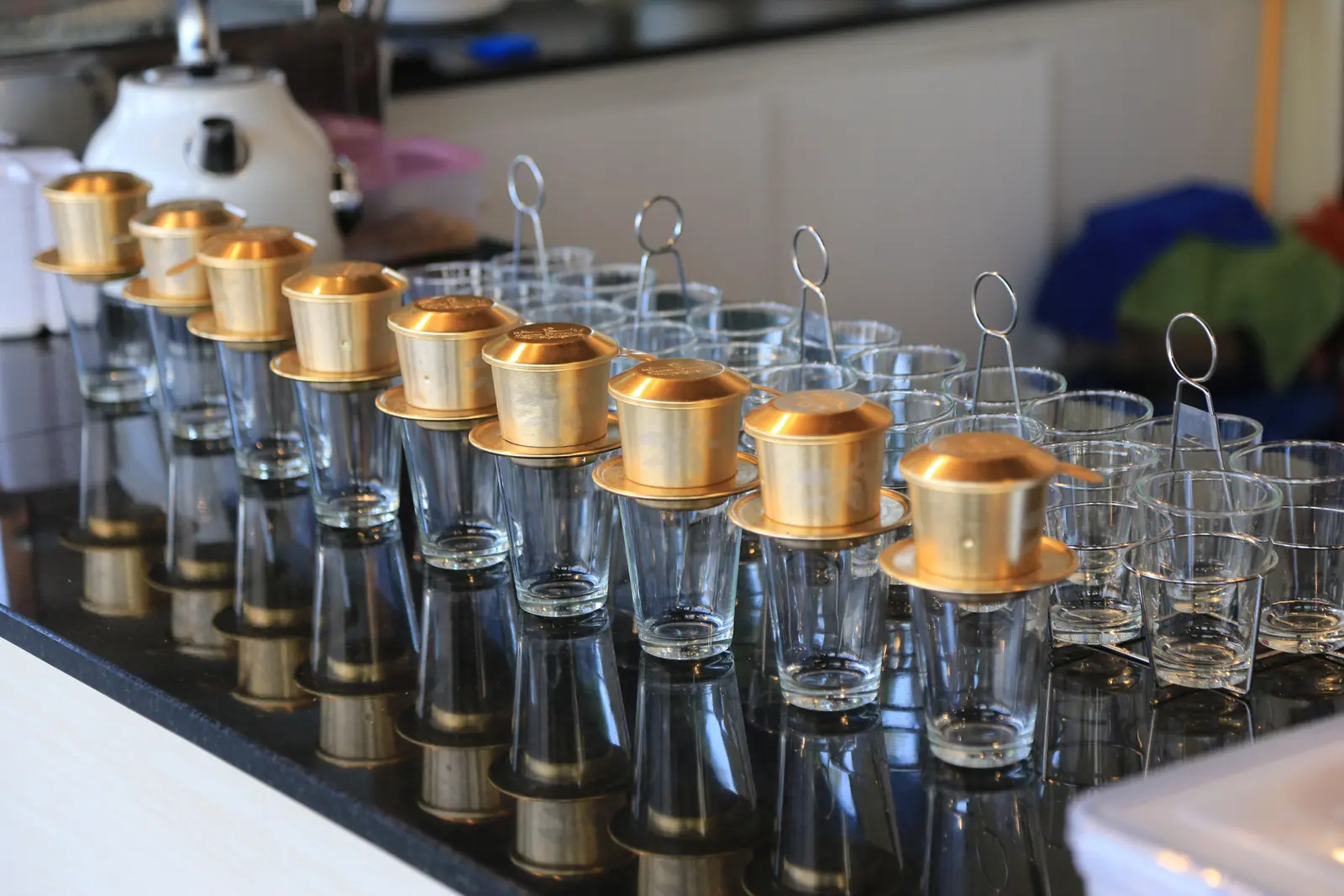 The best cafés to work from in Bangkok Elegant rows of traditional coffee makers on a café countertop in Bangkok, Thailand.