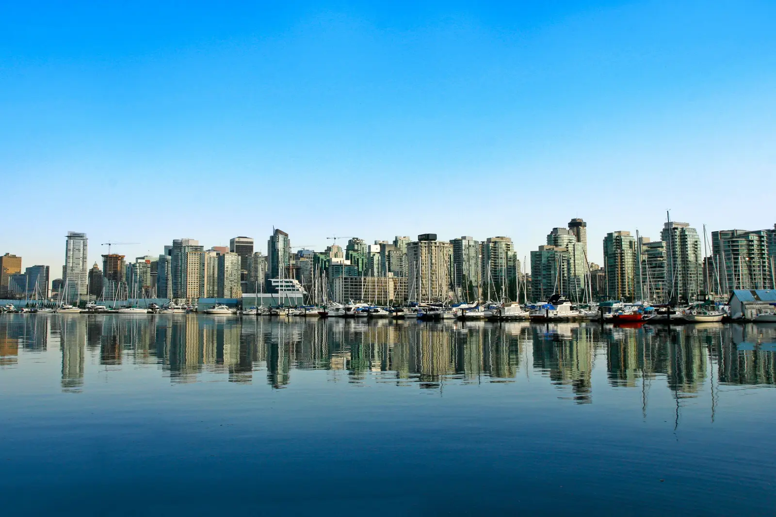 Explore the stunning Vancouver skyline with a picturesque waterfront. Perfect for travel and cityscape enthusiasts.