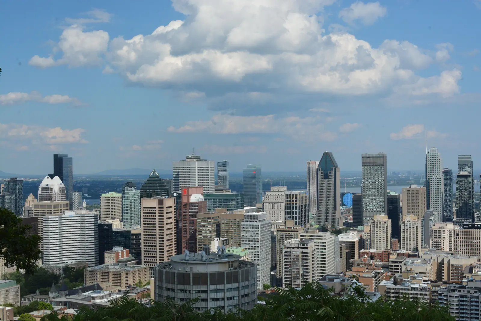 Aerial view of Montreal's downtown skyscrapers at dusk, showcasing a blend of modern architecture.